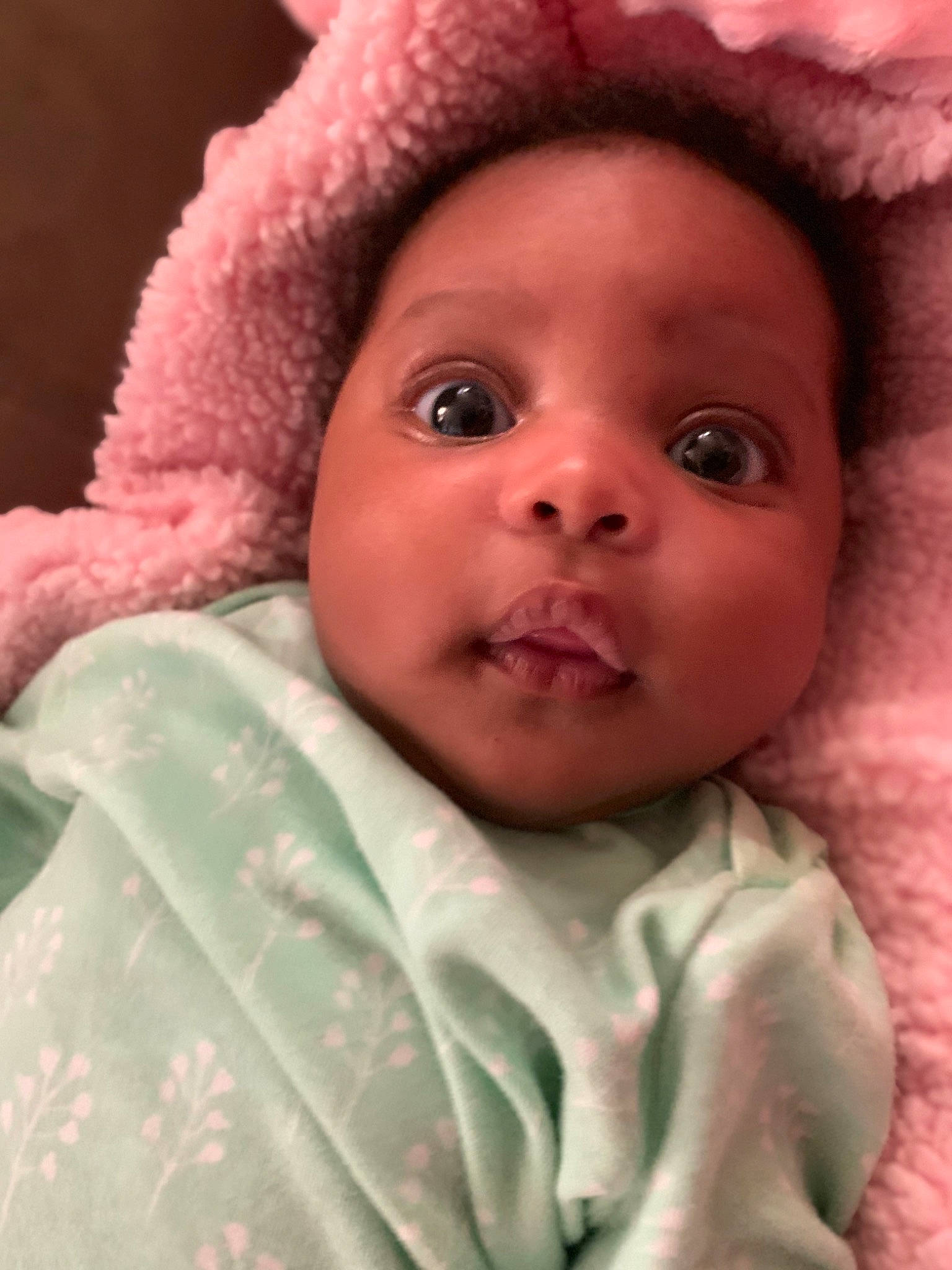 Marcella is registered to the contest to win money with this photo: baby, cheek, child, chin, close_up, eye, eyebrow, face, forehead, head, headgear, iris, lip, mouth, nose, person, pink, portrait_photography, skin, smile