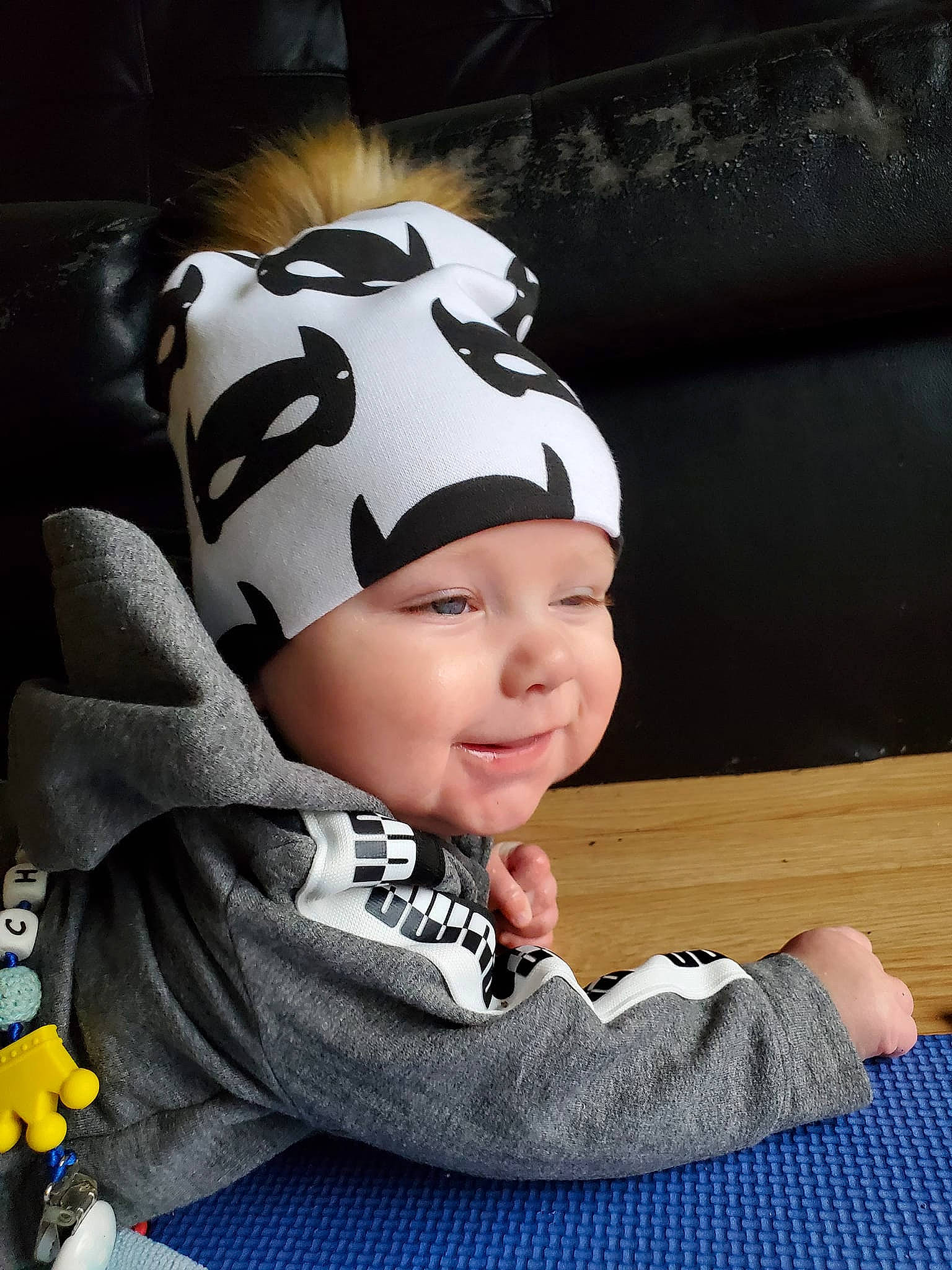 Christopher participe au concours pour gagner de l'argent avec cette photo : baby, baby_toddler_clothing, beanie, cap, cheek, child, fashion_accessory, flash_photography, fun, hair_accessory, happy, headgear, headwear, laugh, outerwear, person, personal_protective_equipment, portrait_photography, sitting, sleeve