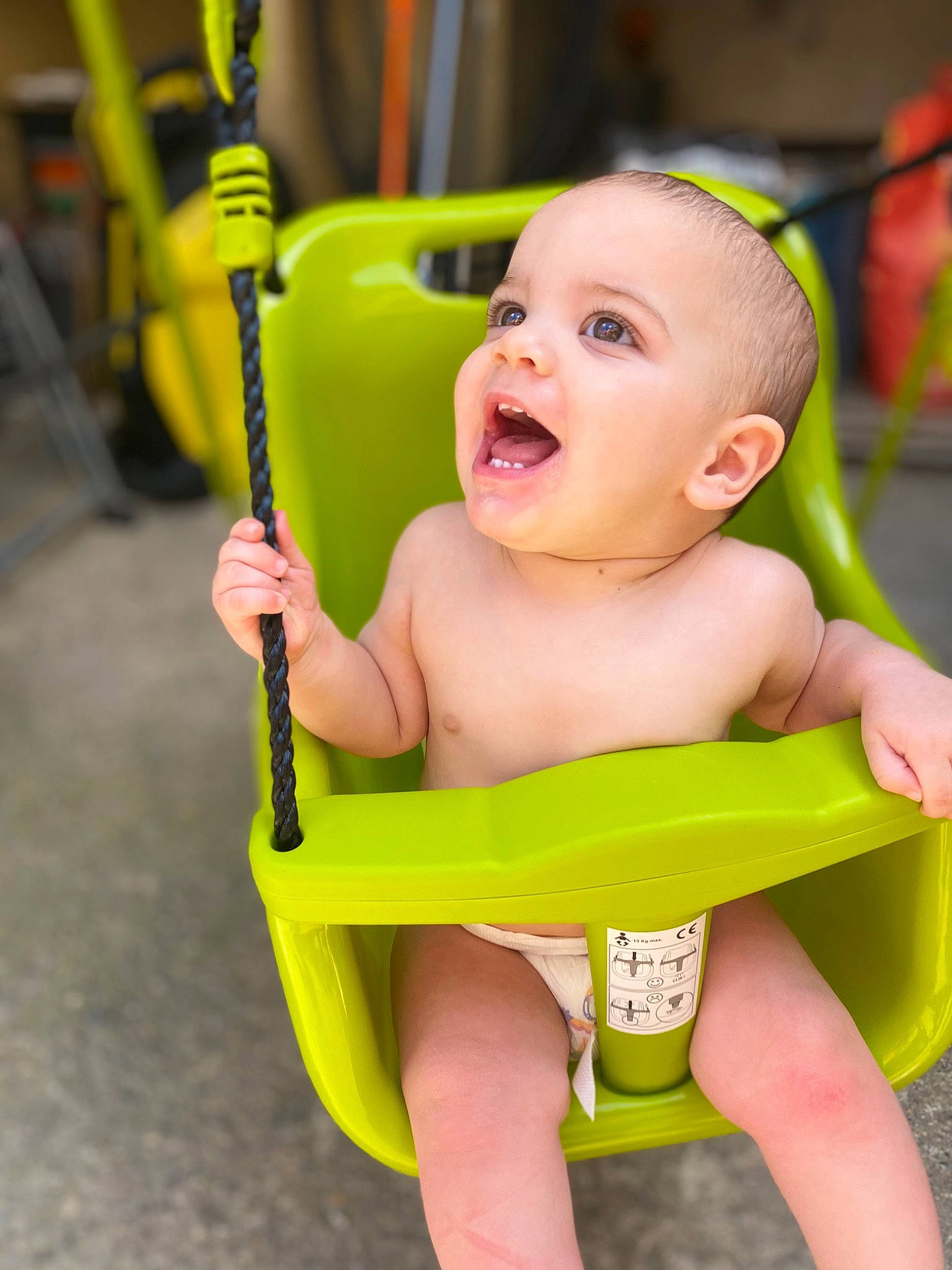 Enzo participe au concours pour gagner de l'argent avec cette photo : baby, baby_products, baby_toddler_clothing, chair, cheek, child, chin, face, fun, green, happy, leisure, person, play, product, sitting, skin, smile, toddler, white