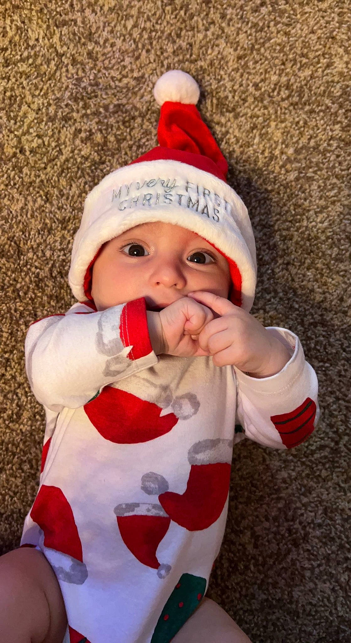 Bentley joined the competition — help win amazing prizes! baby, cheek, child, christmas, christmas_decoration, christmas_ornament, event, eye, face, fictional_character, happy, head, headwear, holiday, human_body, mouth, outerwear, person, santa_claus, sleeve