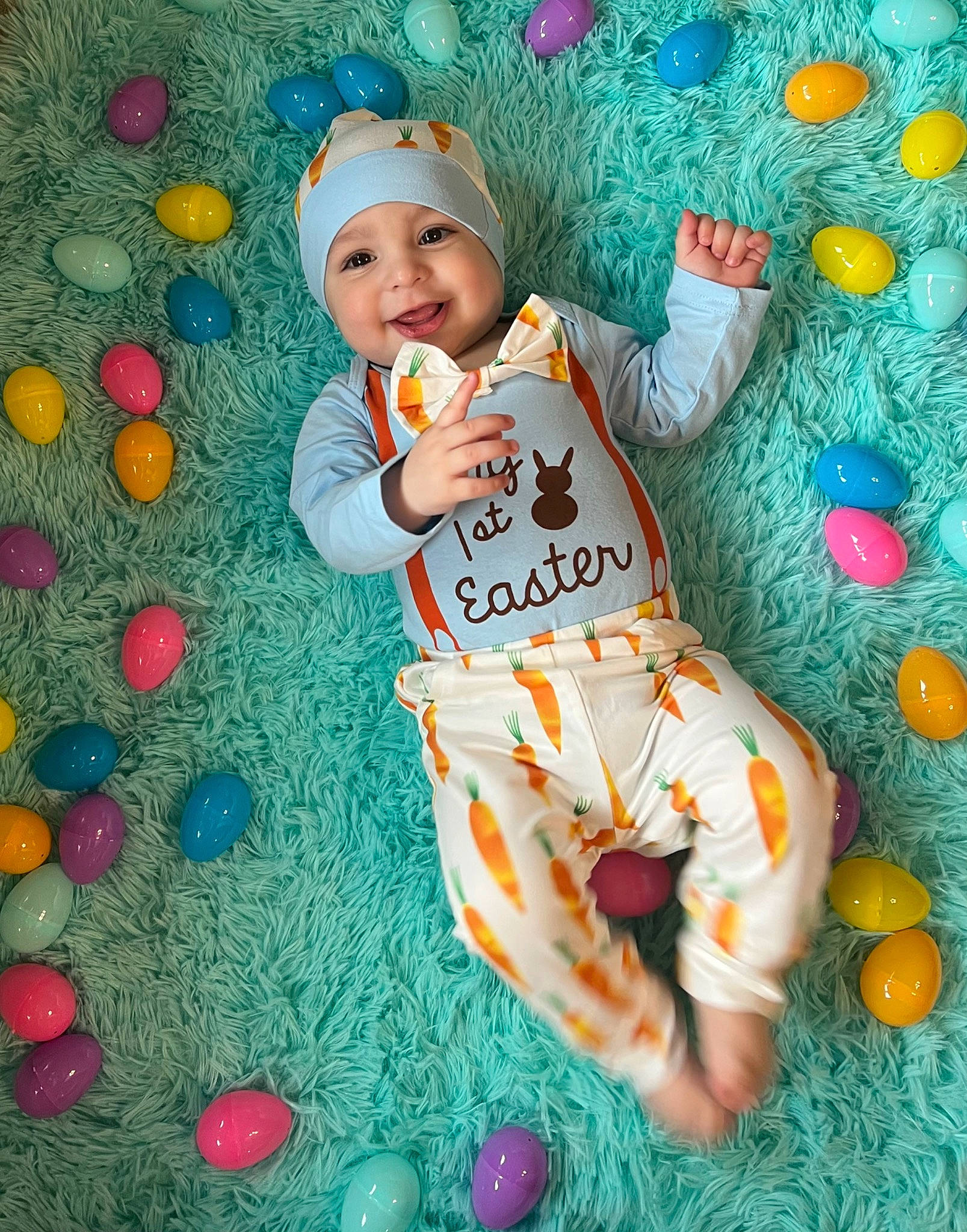 Bentley is registered to the contest to win money with this photo: baby, baby_toddler_clothing, blue, cap, child, event, font, fun, green, happy, hat, headwear, joy, leisure, party_supply, pattern, people_in_nature, person, play, smile