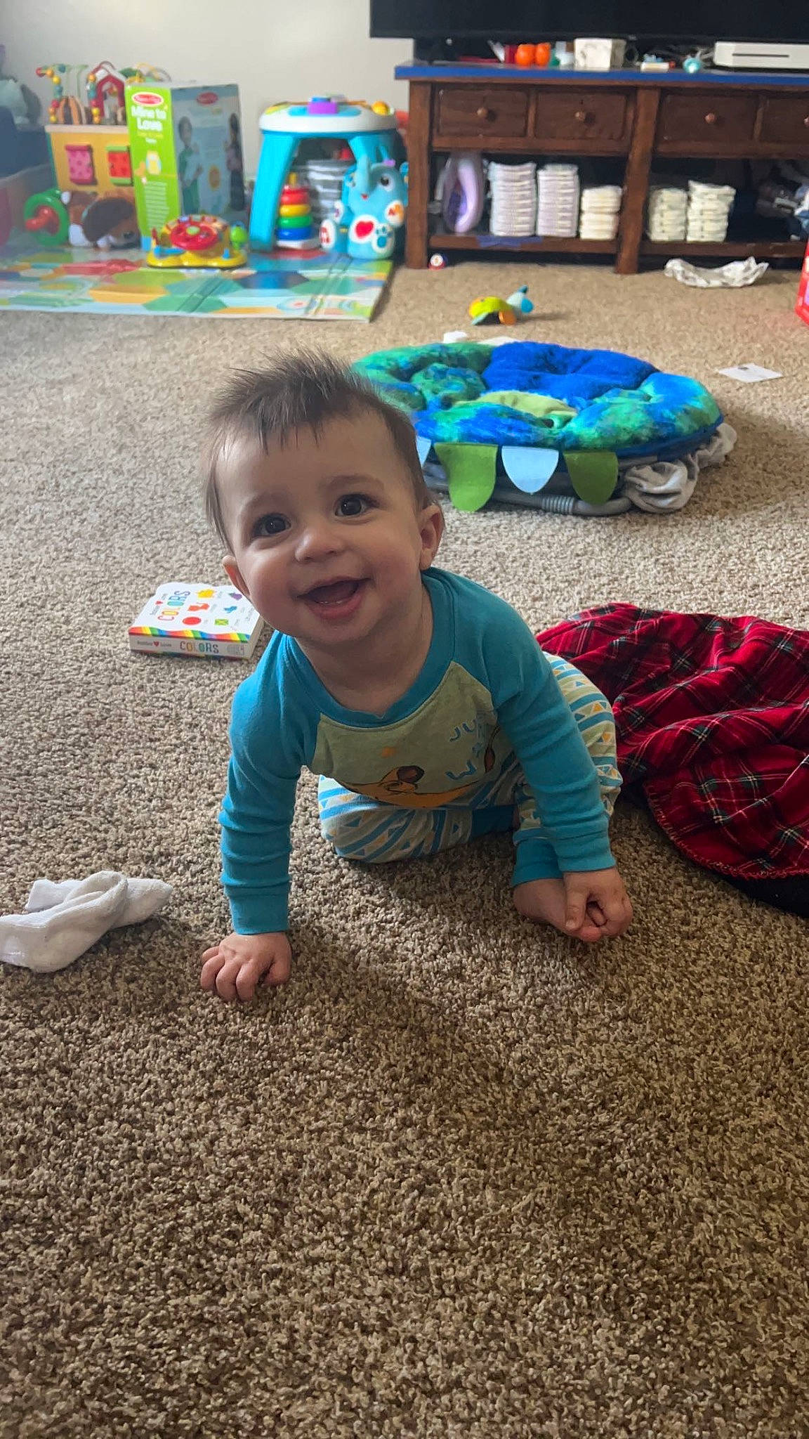 Bentley is registered to the contest to win money with this photo: adaptation, baby, child, flooring, fun, grass, happy, head, joy, leisure, person, play, public_space, recreation, road_surface, sand, sitting, smile, soil, toddler