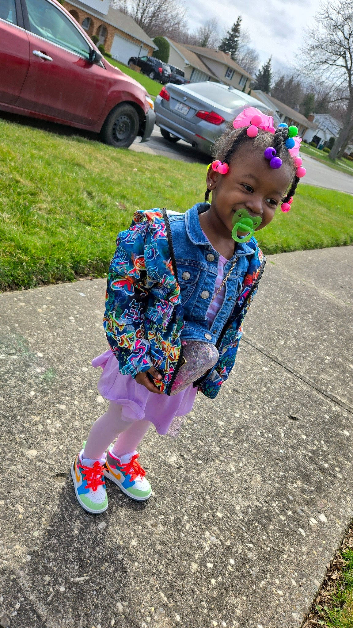 Ty'Ayla joined the competition — help win amazing prizes! asphalt, automotive_design, automotive_exterior, automotive_tire, automotive_wheel_system, car, electric_blue, grass, magenta, motor_vehicle, pattern, person, pink, plant, recreation, road, sidewalk, tire, toddler, vehicle_door