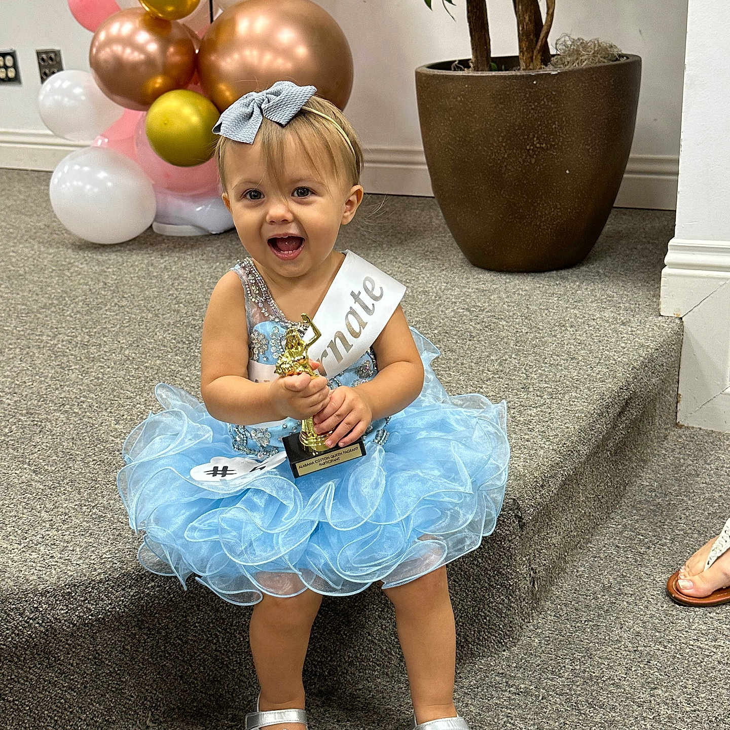 Emory joined the competition — help win amazing prizes! balloon, child, clothing, dress, face, female, flower, flowerarrangement, footwear, girl, head, person, photography, plant, portrait, pottedplant, sandal, shoe, sitting, skirt