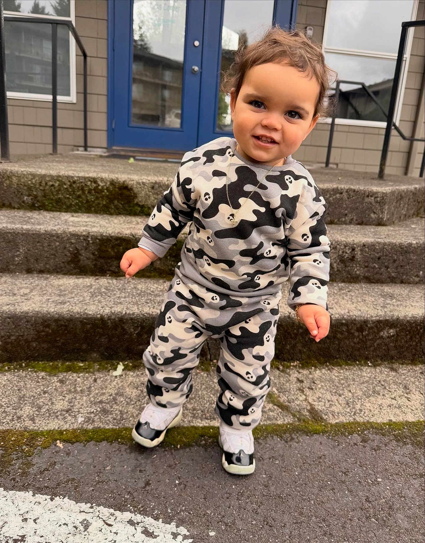 Crixus joined the competition — help win amazing prizes! toddler, child, smiling, standing, outdoor, steps, clothing, sneakers, concrete, moss, door, window, house, bracelet, necklace, person, portrait, curly_hair, cute, casual_wear