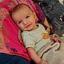 Jaxon joined the competition — help win amazing prizes! baby, infant, smile, blanket, pillow, clothing, bed, comfort, child, face, cute, lying_down, happy, indoors, person, soft, resting, young, cozy, portrait