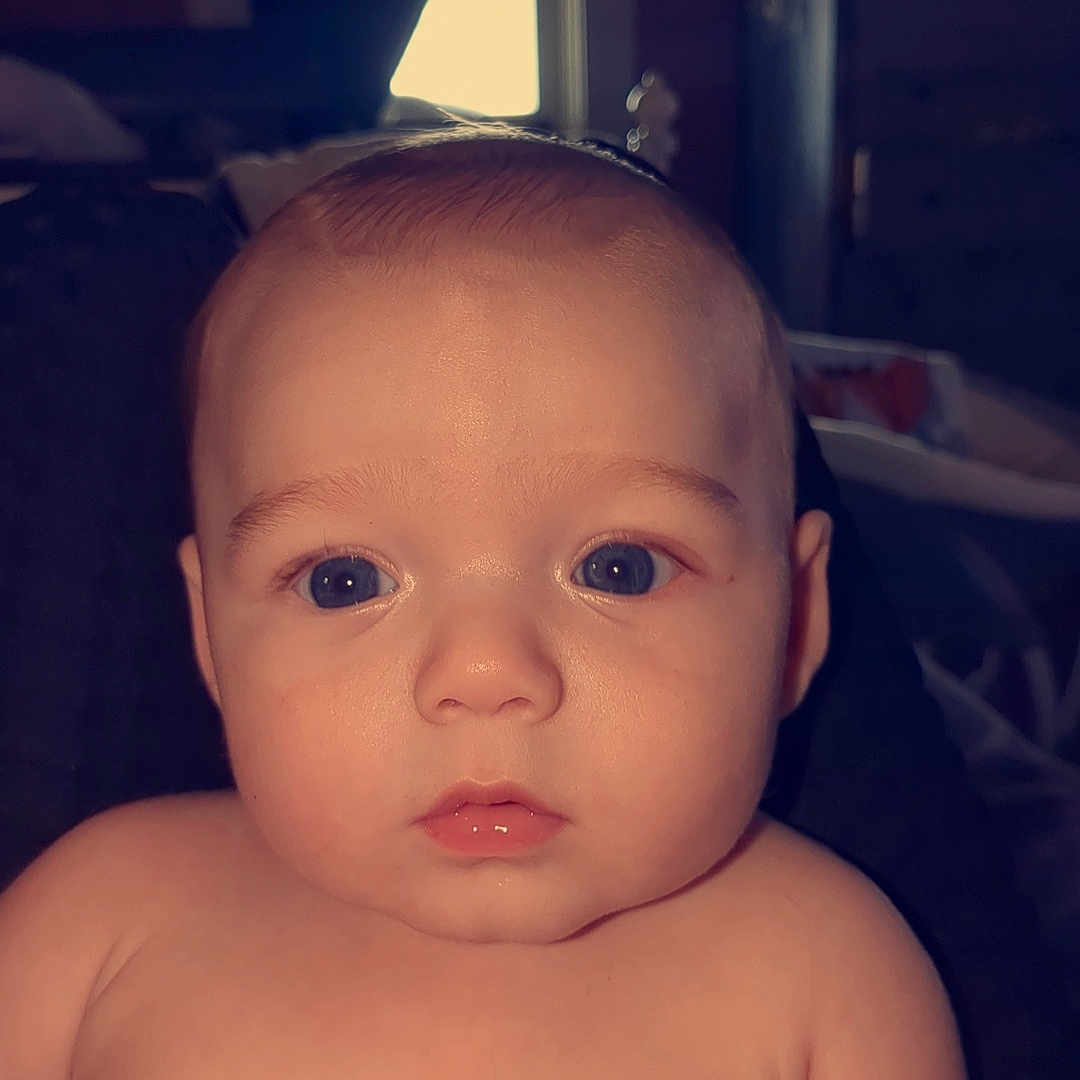 Kylan is registered to the contest to win money with this photo: baby, back, bodypart, couch, ear, face, finger, frown, hand, happy, head, mouth, neck, newborn, person, photography, portrait, sad, sitting, smile