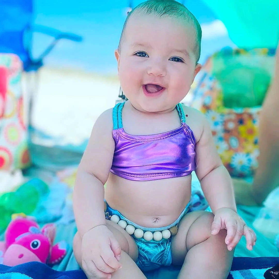 Valarie is registered to the contest to win money with this photo: aqua, azure, baby, baby_toddler_clothing, blue, finger, fun, green, happy, leisure, mouth, muscle, person, photograph, pink, skin, smile, swimwear, textile, thigh