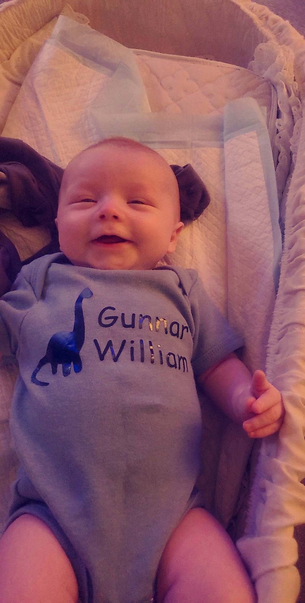 Gunnar is registered to the contest to win money with this photo: baby, baby_toddler_clothing, cheek, comfort, eye, hand, happy, head, human_body, iris, mouth, nose, organ, person, pink, product, skin, sleeve, smile, textile