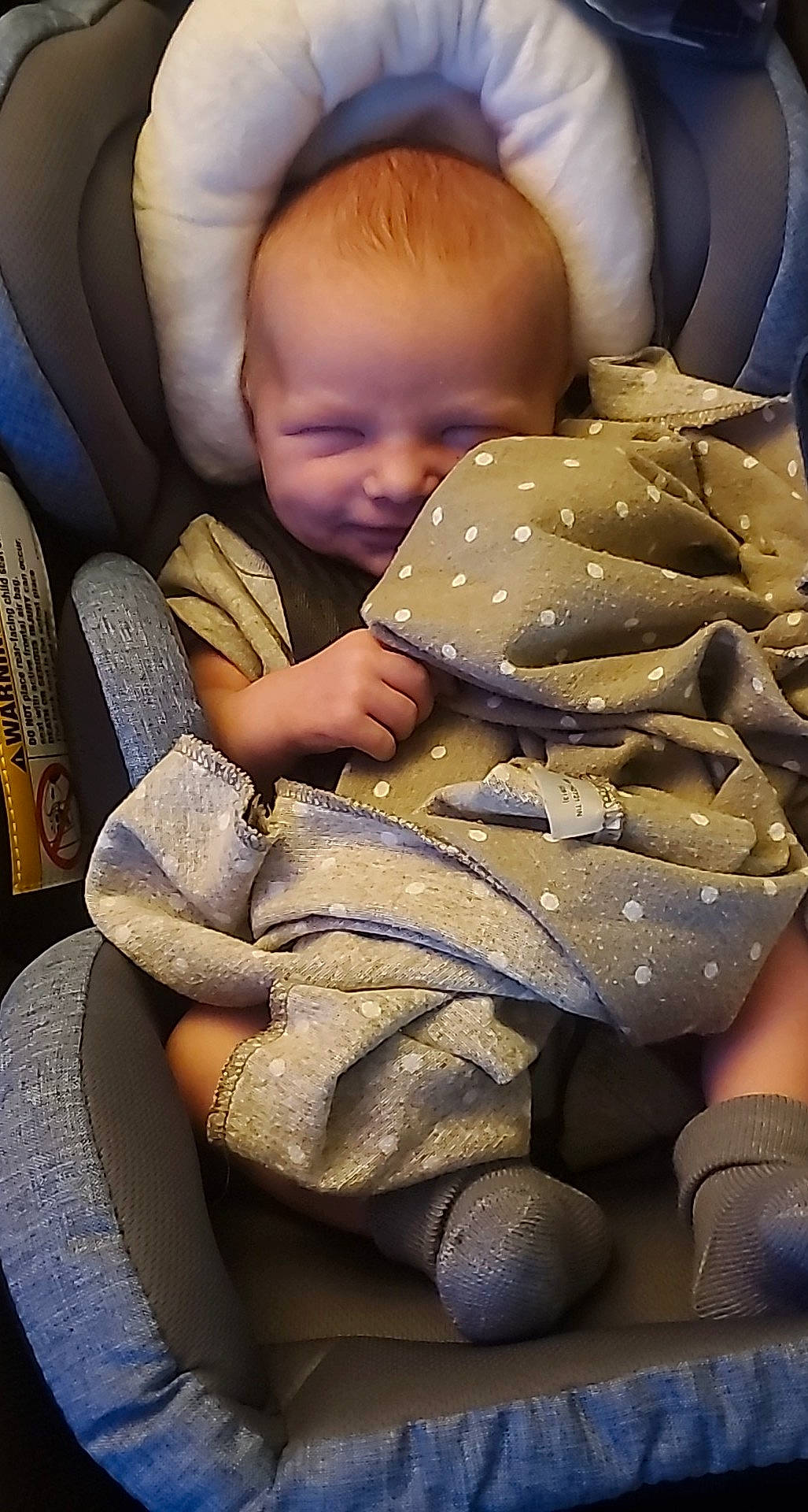 Gunnar is registered to the contest to win money with this photo: baby, baby_in_car_seat, baby_products, baby_sleeping, baby_toddler_clothing, bedtime, car_seat, cheek, child, comfort, human_leg, lap, linens, mouth, nap, pattern, person, room, sitting, skin