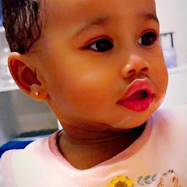 Rema is registered to the contest to win money with this photo: accessories, baby, blackhair, bodypart, clothing, earring, face, hair, happy, head, jewelry, mouth, neck, person, photography, portrait, shoulder, skin, smile, t_shirt