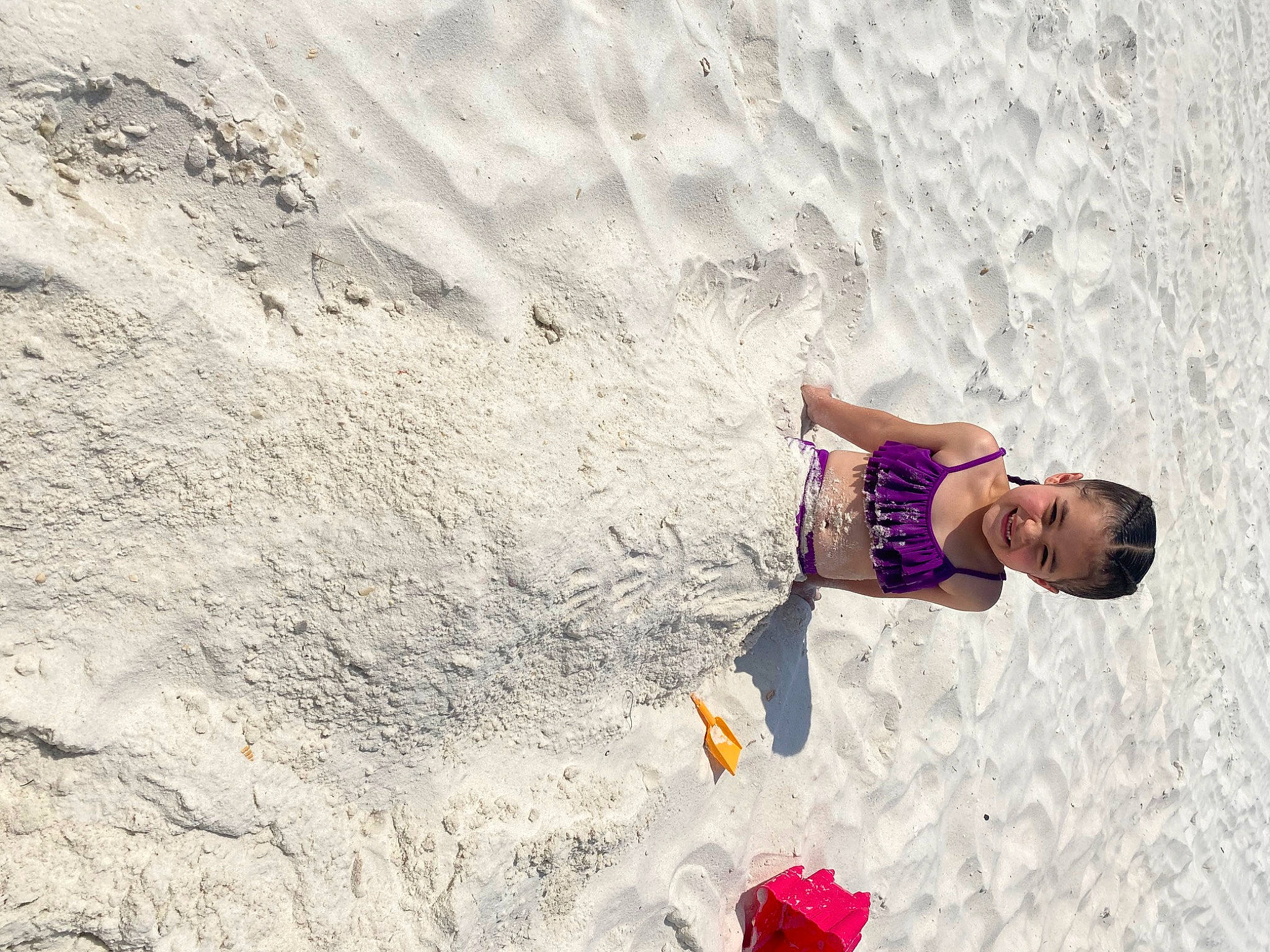 Ellen joined the competition — help win amazing prizes! aeolian_landform, beach, body_of_water, dune, eyewear, fun, happy, human_leg, joy, landscape, leisure, ocean, people_in_nature, people_on_beach, person, recreation, rock, sand, shadow, soil