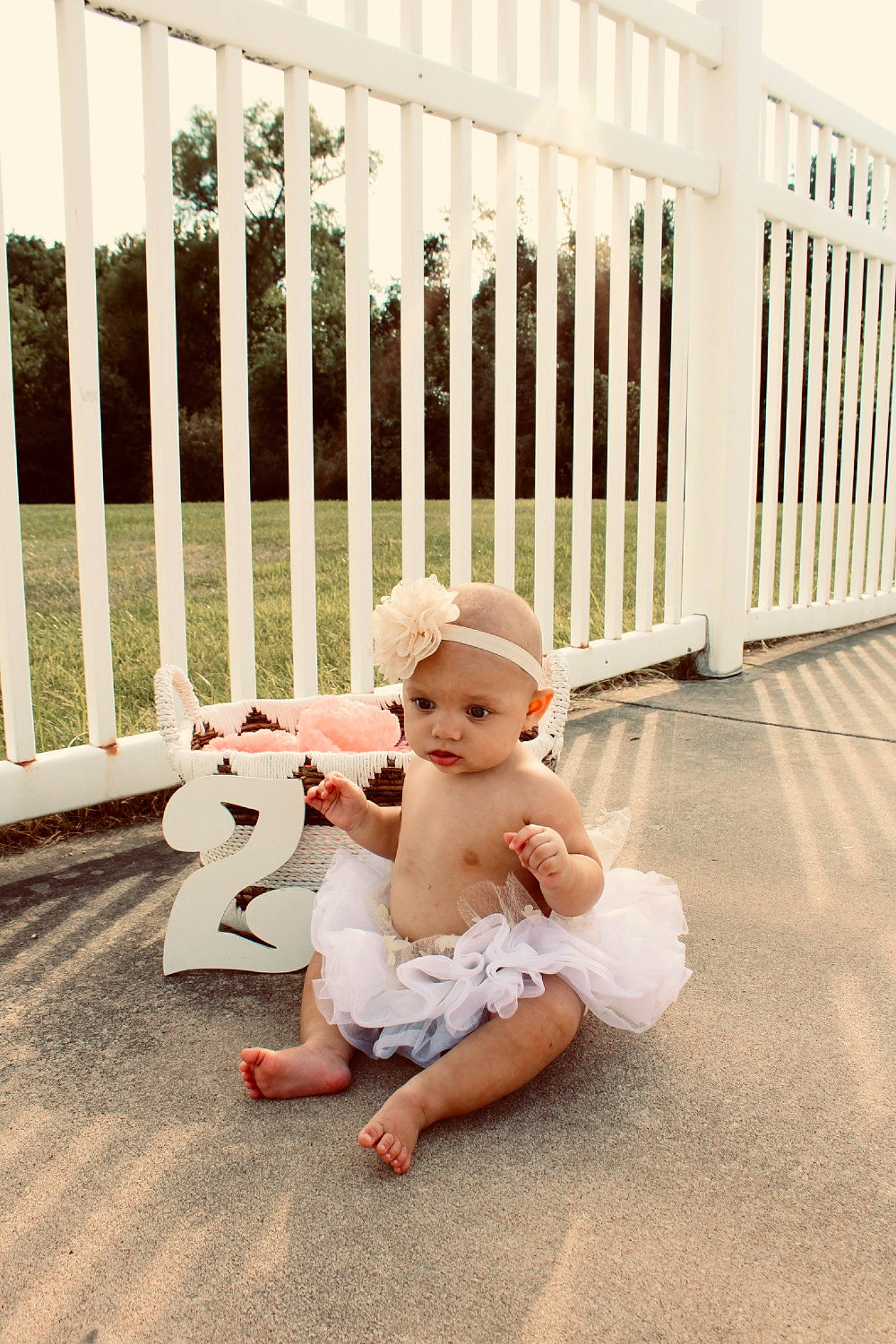 Zamiri joined the competition — help win amazing prizes! baby, baluster, child, fence, floor, flooring, fun, grass, handrail, happy, headwear, leisure, mammal, person, picket_fence, sandal, sitting, standing, stock_photography, toddler