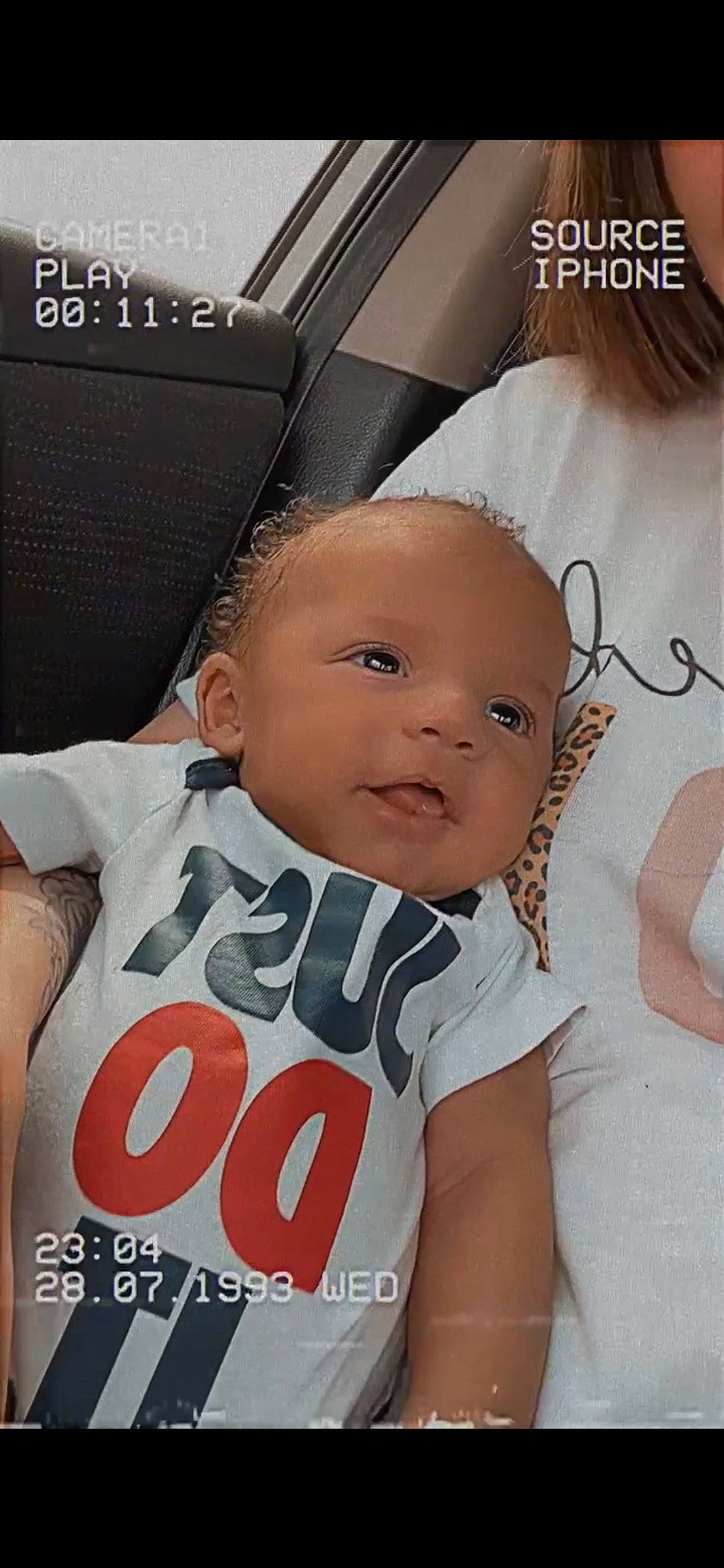 Kameron is registered to the contest to win money with this photo: baby, baby_toddler_clothing, chest, child, cool, finger, font, fun, gesture, hairstyle, happy, human, person, photo_caption, pink, skin, sleeve, smile, t_shirt, thumb