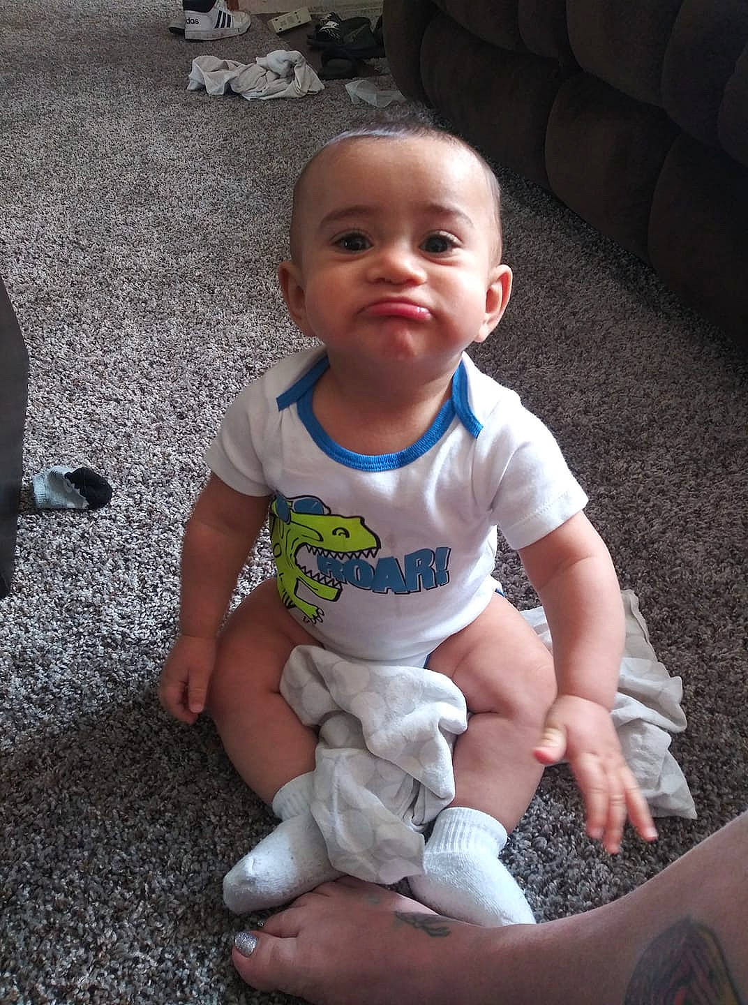 Dane is registered to the contest to win money with this photo: baby, child, leg, person, play, sitting, skin, smile, toddler