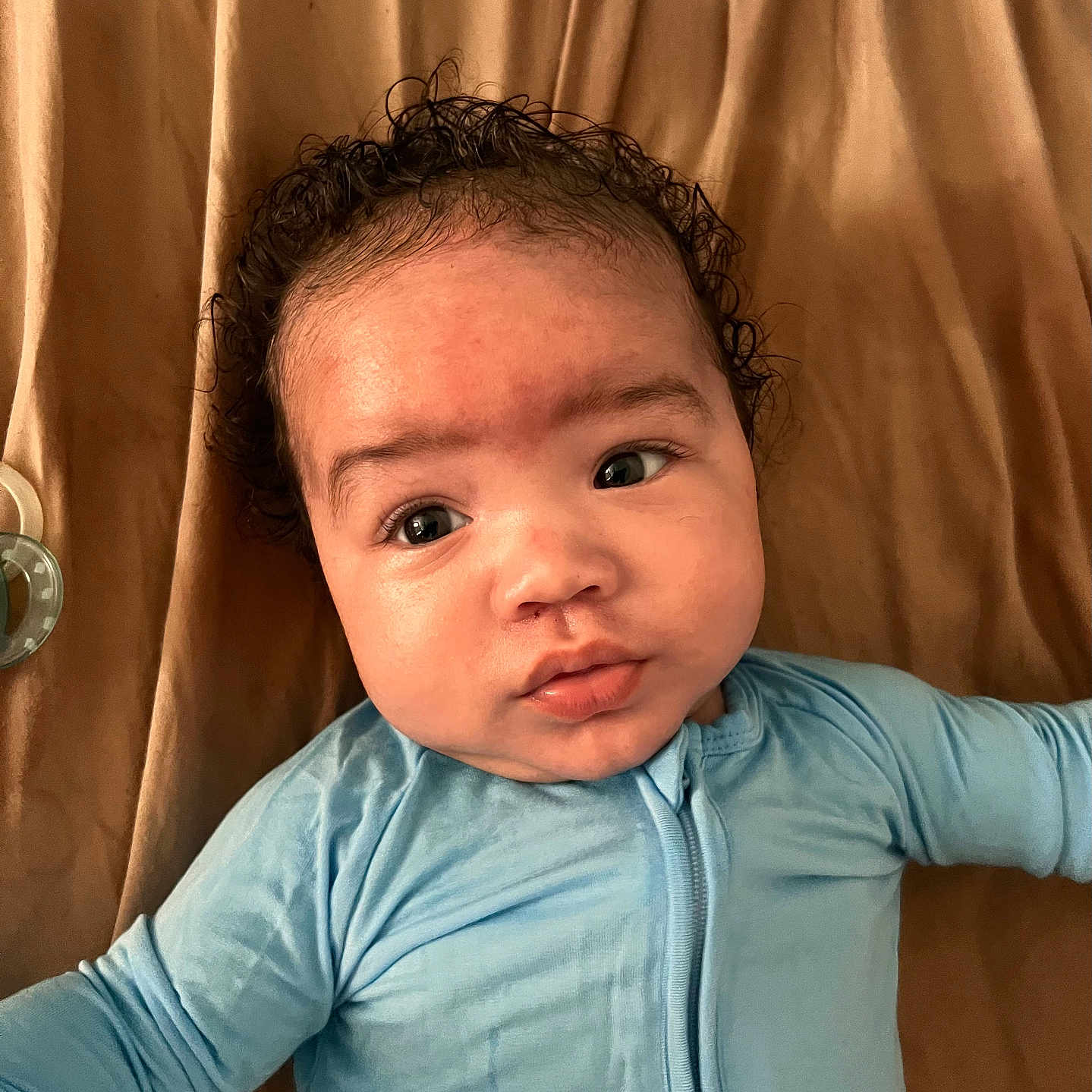 Jace is registered to the contest to win money with this photo: baby, bodypart, clothing, face, finger, frown, hair, hand, happy, head, longsleeve, newborn, person, photography, portrait, sad, selfie, skin, sleeve, smile