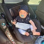 Matys a rejoint le concours — aidez-le/la à gagner de superbes lots ! baby, car_seat, pacifier, hat, infant, child, smiling, inside_car, sunlight, seatbelt, clothing, foot, sitting, happy, vehicle, window, door, fabric, comfort, casual