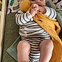 Matys a rejoint le concours — aidez-le/la à gagner de superbes lots ! baby, infant, plush_toy, striped_clothing, hand, pillow, whale_pattern, blanket, bed, person, indoor, soft_toy, child, cute, lying_down, skin, foot, fingers, warm, comfort