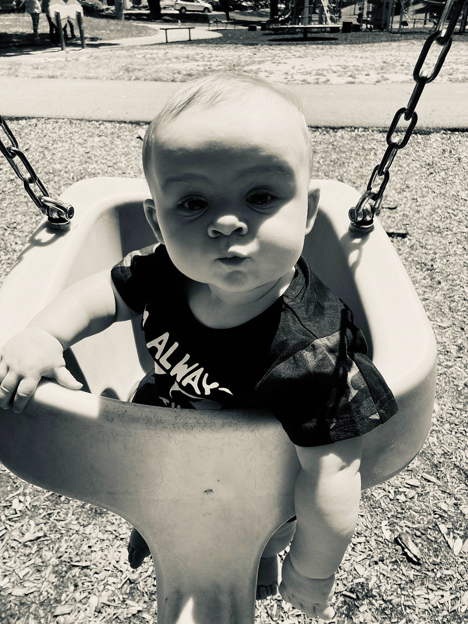 Jordan is registered to the contest to win money with this photo: arm, black, black_and_white, cool, eye, fun, grass, hand, happy, human_body, monochrome, monochrome_photography, organ, person, photograph, plant, standing, style, toddler, tree