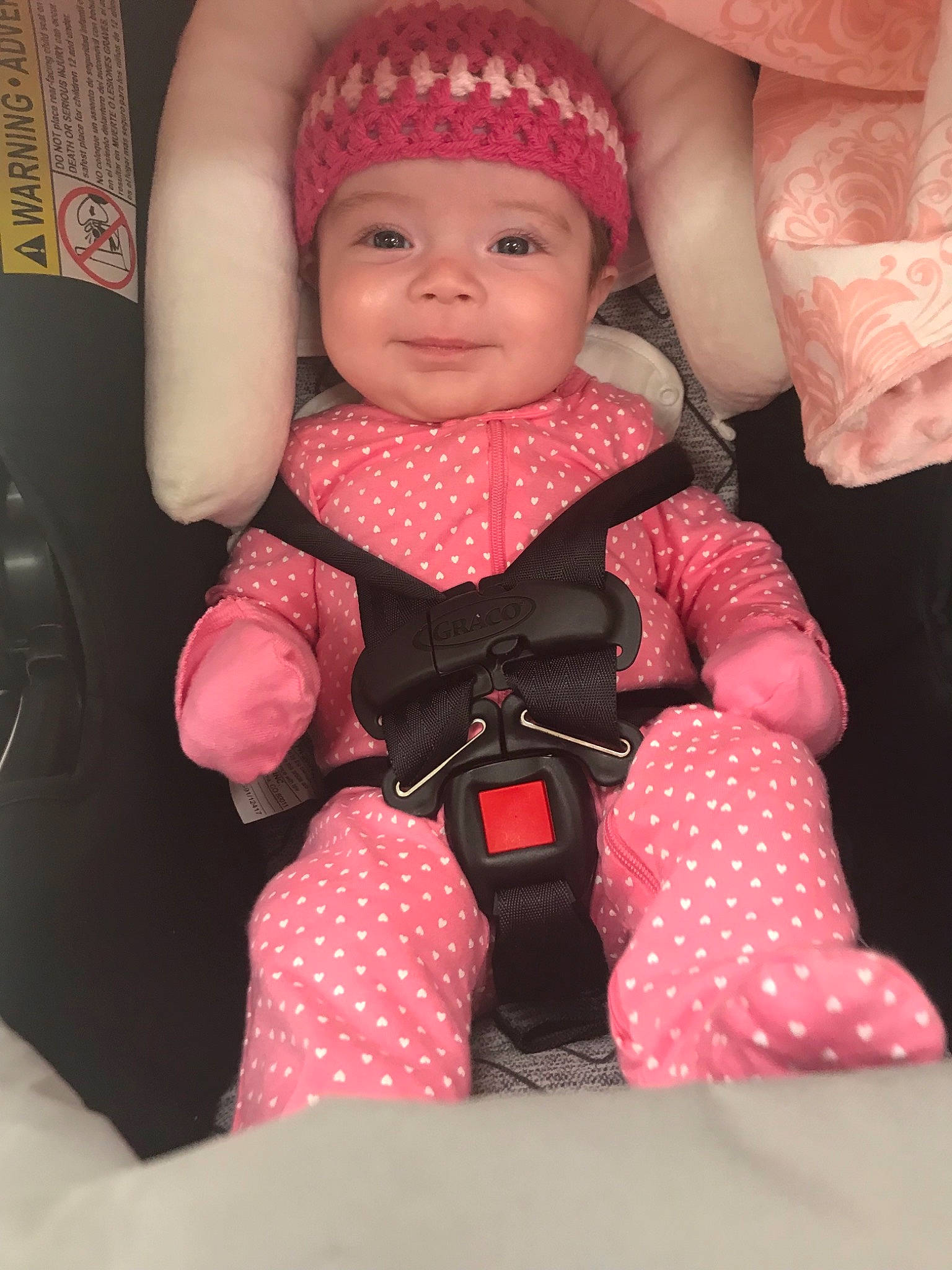 Norah joined the competition — help win amazing prizes! baby_products, car_seat, child, design, doll, girl, infant, magenta, pattern, person, pink, polka_dot, product, red, skin, textile, toddler, toy