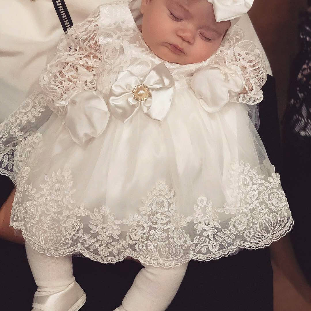 Norah is registered to the contest to win money with this photo: blouse, bridal_accessory, bridal_clothing, child, costume, dress, girl, gown, hair_accessory, joint, lace, material, neck, outerwear, person, shoulder, sleeve, textile, trunk, wedding_dress