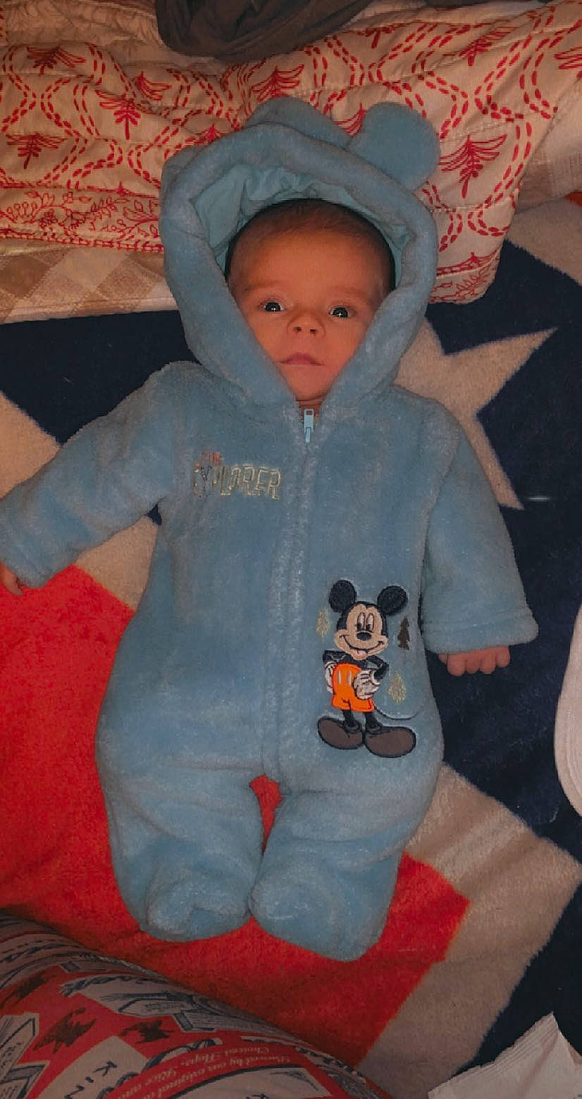 Joey joined the competition — help win amazing prizes! baby, baby_toddler_clothing, cheek, child, comfort, eye, finger, human_body, jacket, linens, mouth, nose, orange, organ, person, pink, skin, sleeve, stuffed_toy, textile