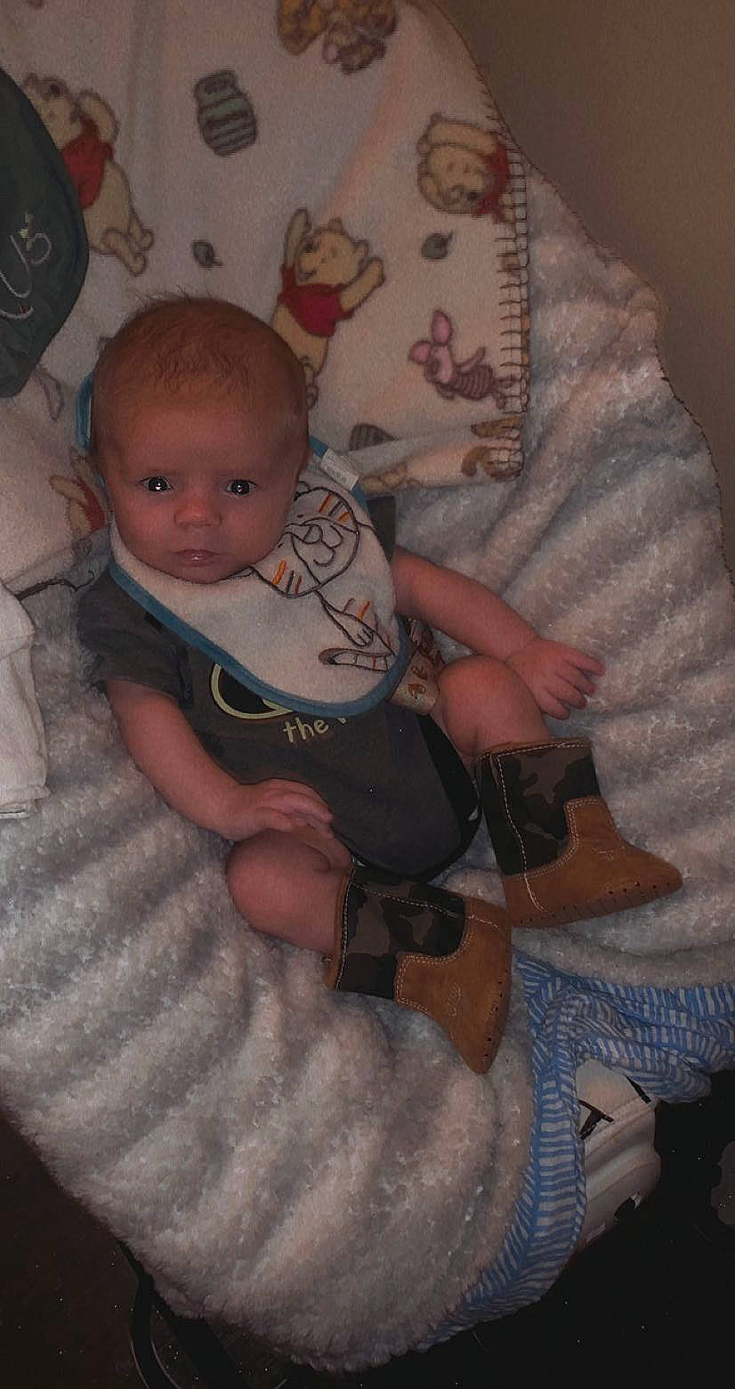 Joey is registered to the contest to win money with this photo: abdomen, baby, baby_products, baby_toddler_clothing, chair, cheek, child, comfort, elbow, finger, fun, hand, head, lap, linens, person, sitting, sleeve, thumb, toddler