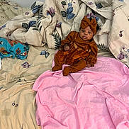 Autumn joined the competition — help win amazing prizes! baby, infant, bed, blanket, floral_pattern, pink_towel, headband, clothing, sleepwear, person, indoors, resting, cute, small, fabric, textile, soft, child, portrait, laying