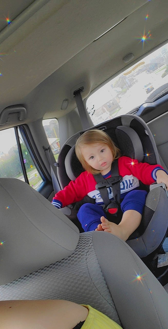 Anthony is registered to the contest to win money with this photo: air_travel, auto_part, automotive_design, automotive_exterior, car, car_seat, car_seat_cover, comfort, family_car, head_restraint, mode_of_transport, motor_vehicle, person, personal_luxury_car, seat_belt, steering_part, steering_wheel, toddler, vehicle, vehicle_door