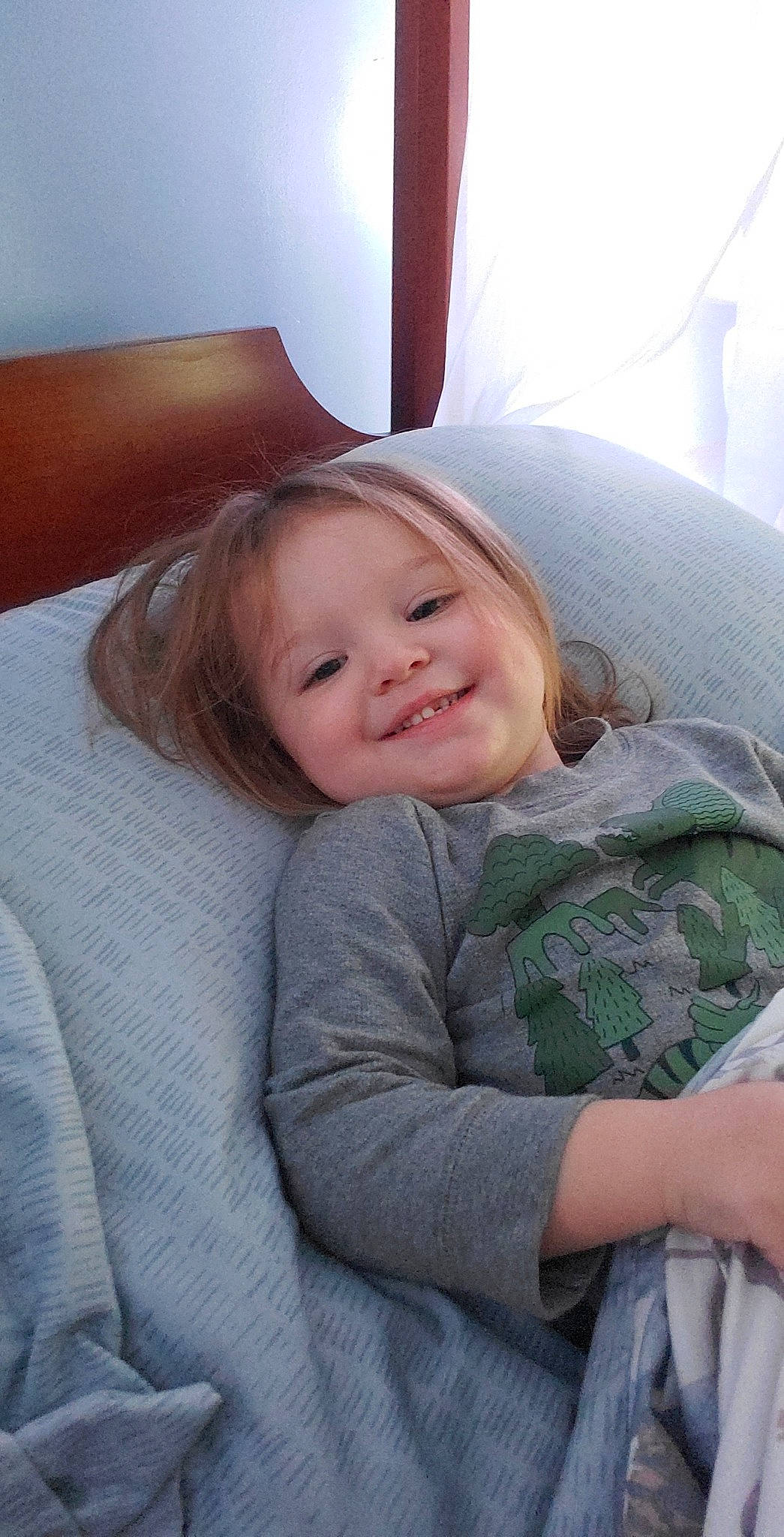 Anthony is registered to the contest to win money with this photo: blond, comfort, couch, eye, face, hair, hairstyle, happy, head, iris, joy, linens, lip, mouth, nose, person, skin, sleeve, smile, textile