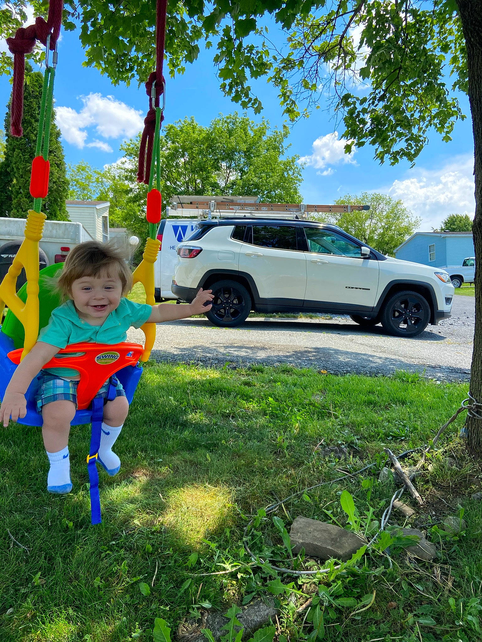 Cassius joined the competition — help win amazing prizes! automotive_exterior, blue, car, cloud, electric_blue, grass, green, happy, joy, landscape, leisure, motor_vehicle, people_in_nature, person, plant, sky, tire, toddler, tree, vehicle