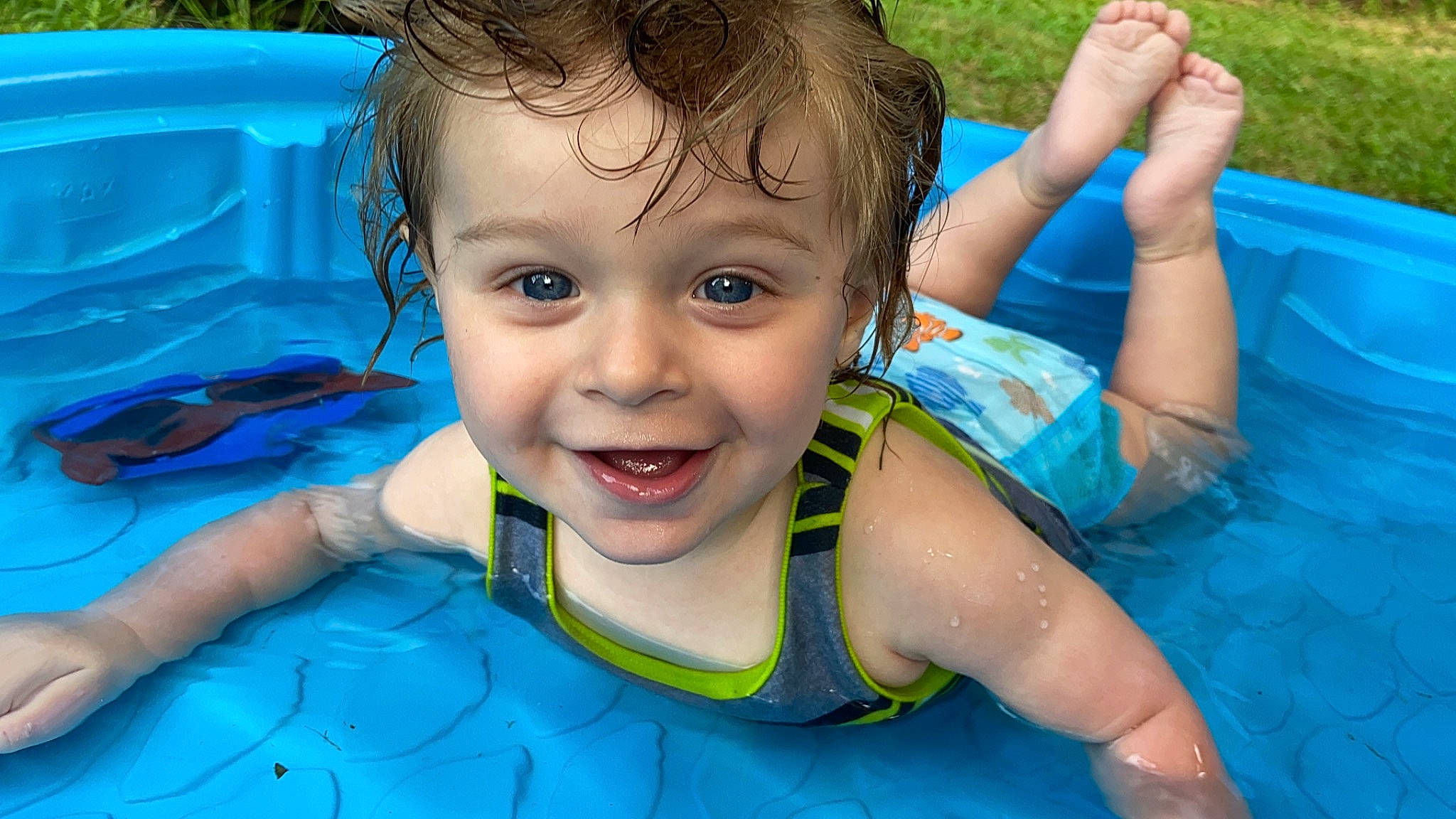 Cassius is registered to the contest to win money with this photo: aqua, azure, baby_float, bathing, beauty, blue, facial_expression, fun, hair, happy, head, joy, leisure, lifejacket, outdoor_recreation, person, personal_protective_equipment, product, recreation, smile