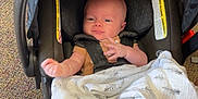 Samuel is registered to the contest to win money with this photo: baby, bed, blanket, car, car_interior, carseat, clothing, crib, face, furniture, head, homedecor, infantbed, newborn, person, photography, portrait, stroller, transportation, vehicle