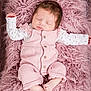 baby, newborn, infant, sleeping, pink, onesie, wooden_floor, faux_fur, blanket, bed, portrait, cute, closed_eyes, peaceful, toes, hand, clothing, cozy, studio_photography, buttoned_clothing