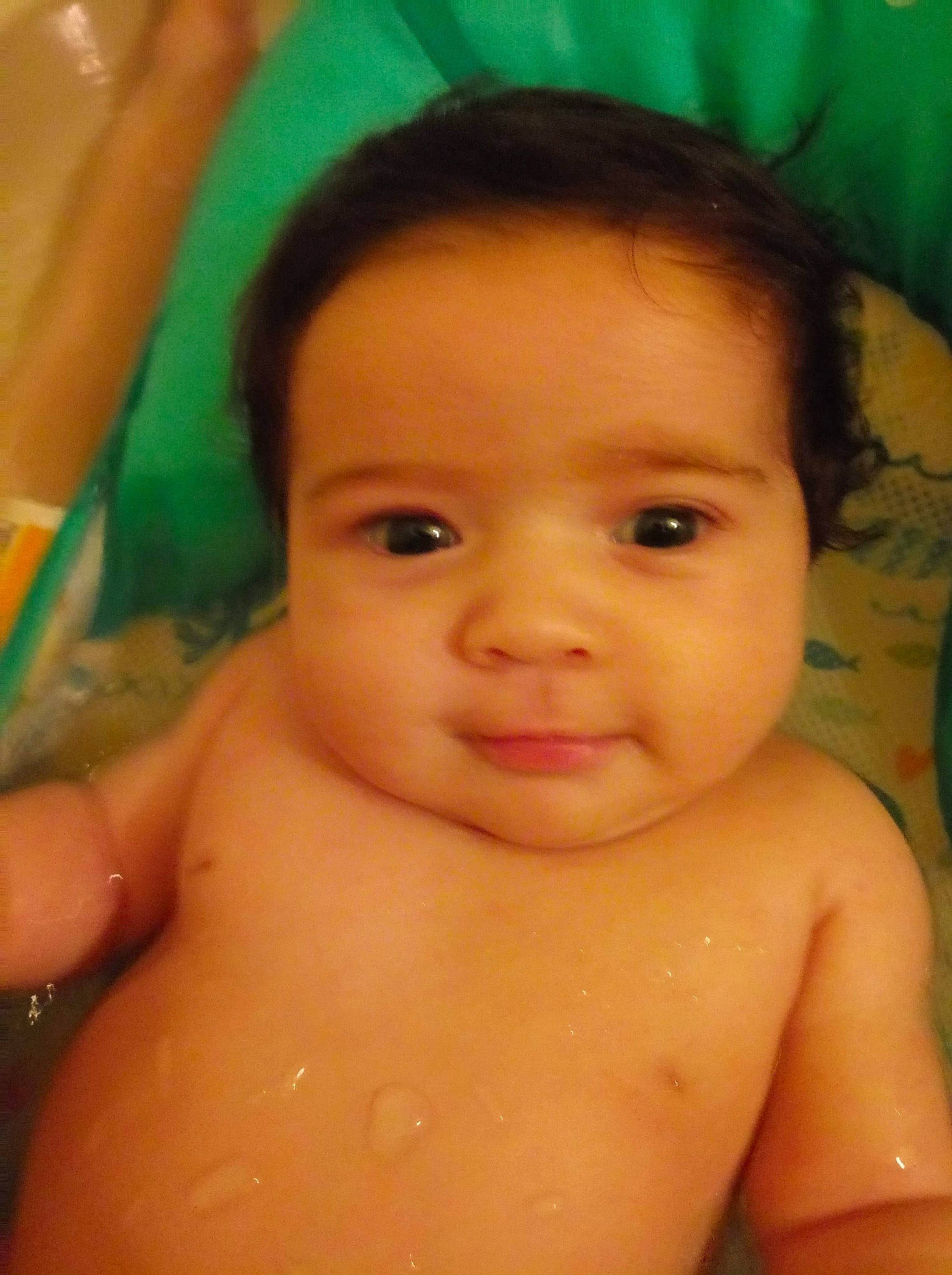 Keri is registered to the contest to win money with this photo: baby, bathing, cheek, chest, child, close_up, eye, eyebrow, face, forehead, fun, head, iris, lip, mouth, muscle, nose, person, skin, smile