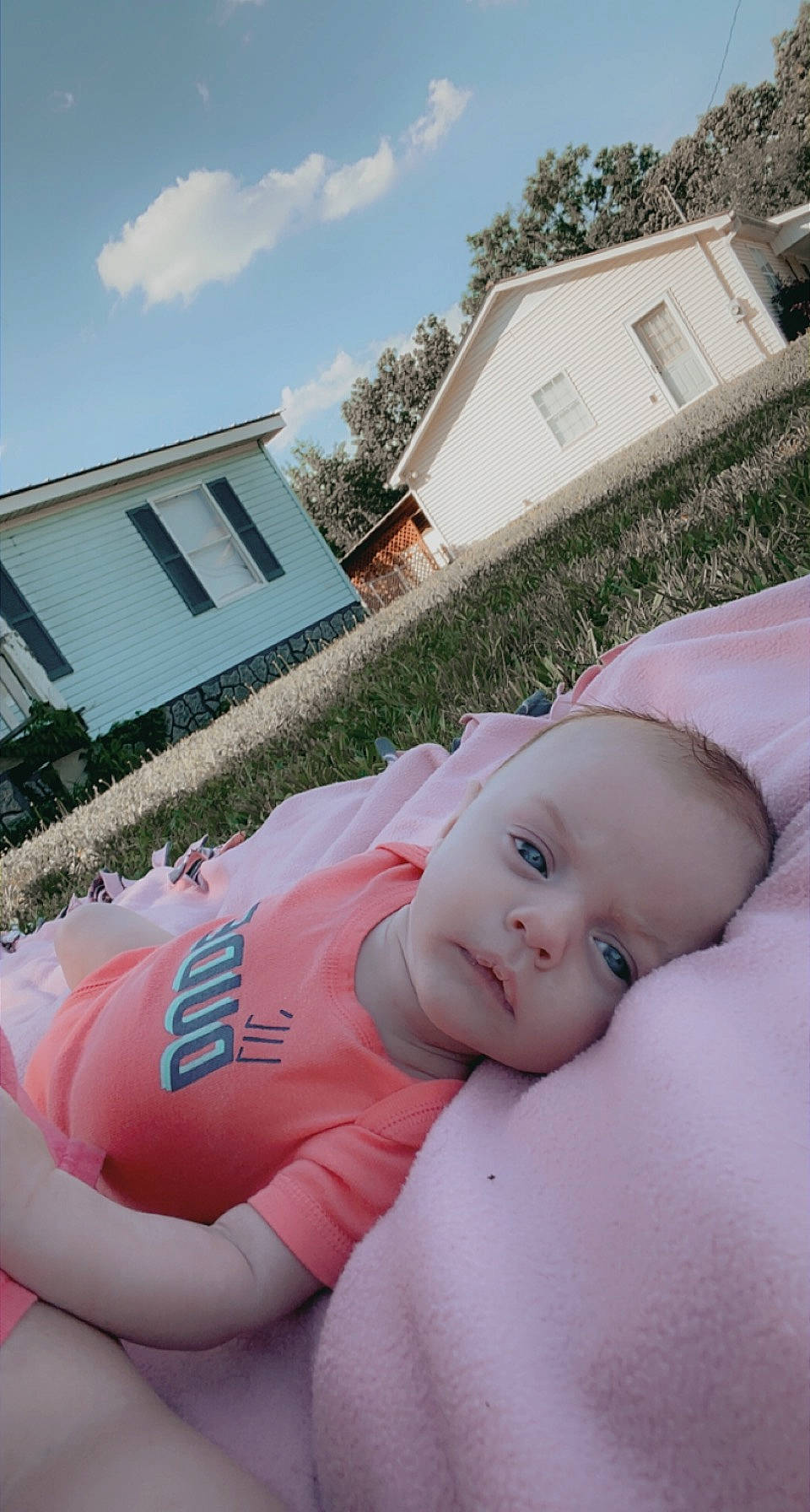 Raylan joined the competition — help win amazing prizes! baby, baby_products, baby_toddler_clothing, child, cloud, cottage, fun, grass, happy, house, leisure, person, pink, plant, recreation, sitting, sky, toddler, tree, vacation