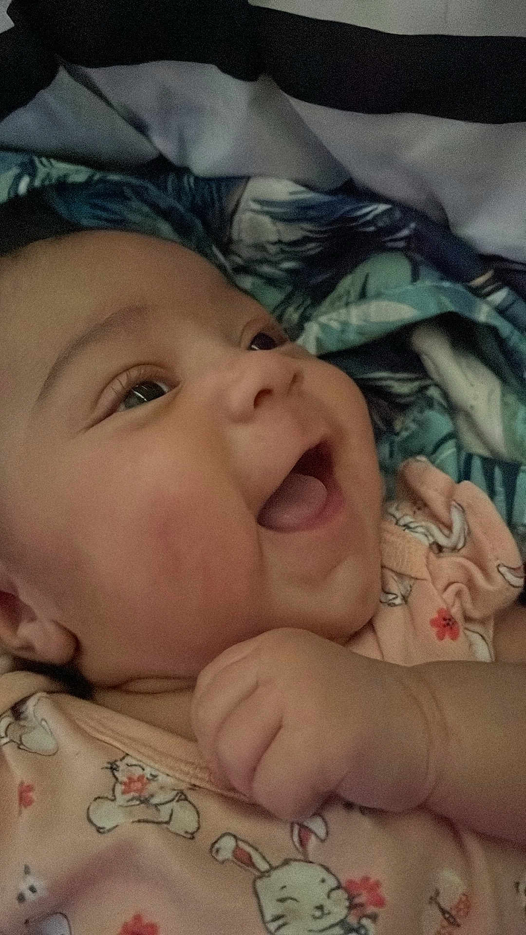 Zyra joined the competition — help win amazing prizes! baby, child, smiling, happy, face, hand, clothing, infant, closeup, cute, patterned_clothing, blanket, bed, portrait, skin, cheeks, eyes, lying_down, indoor, young_child