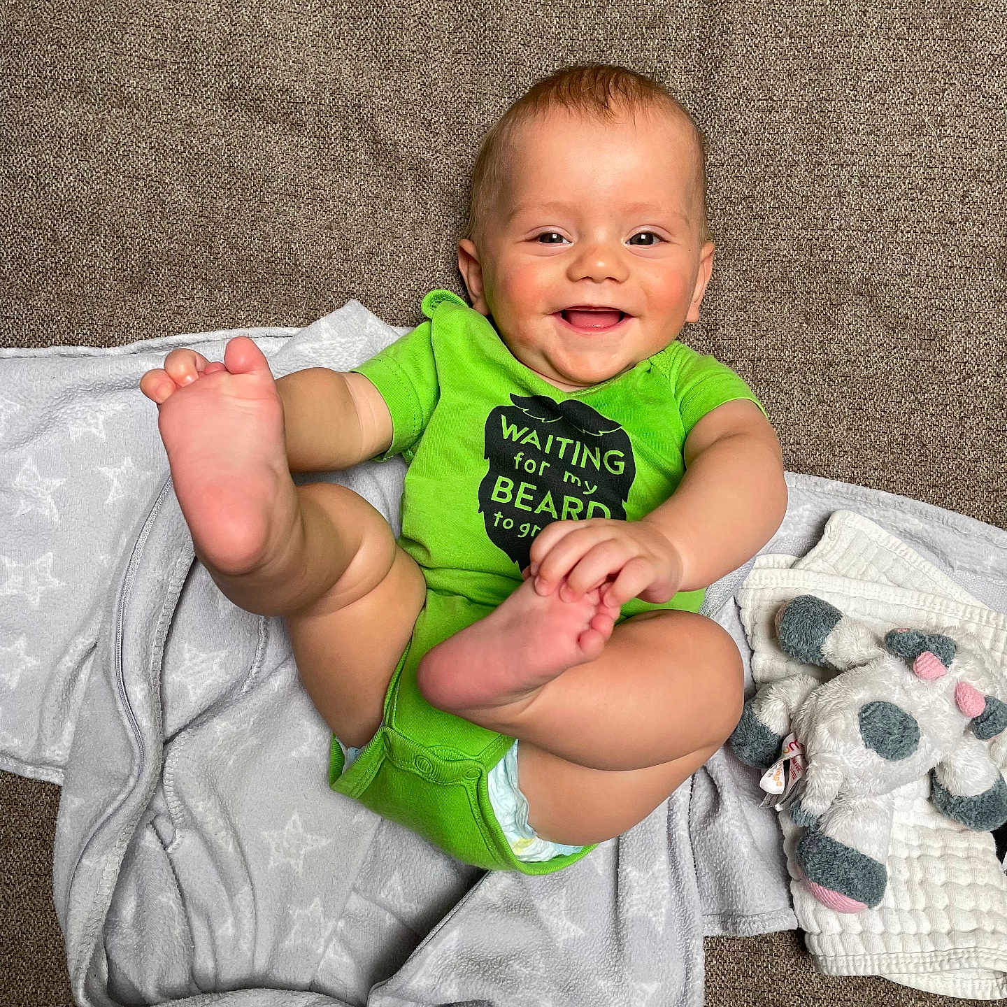 Chandler joined the competition — help win amazing prizes! baby, blanket, clothing, couch, cushion, face, furniture, happy, head, homedecor, indoors, laughing, pants, person, photography, portrait, shorts, sitting, smile, t_shirt