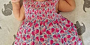 Lottie is registered to the contest to win money with this photo: baby, smiling, headband, dress, patterned_clothing, blanket, elephant_pattern, infant, happy, lying_down, cute, child, indoors, colorful, playful, young_child, soft_texture, fabric, cheerful, portrait