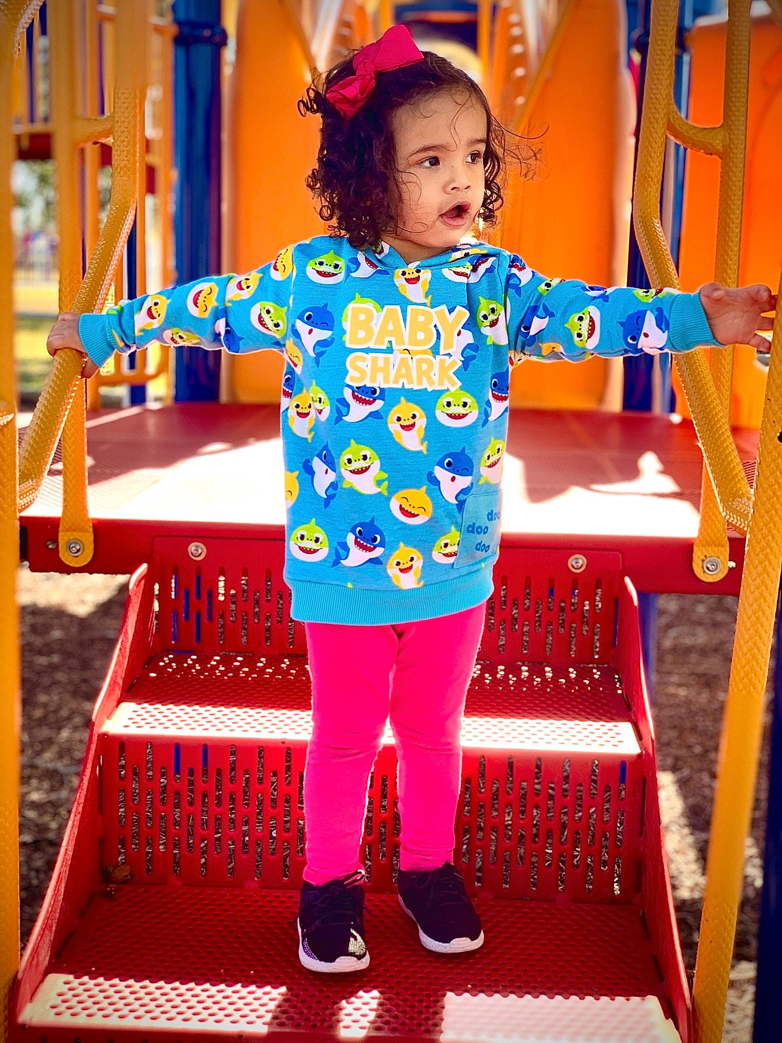Annalyn is registered to the contest to win money with this photo: baby_toddler_clothing, blue, child, city, electric_blue, flooring, fun, happy, human_leg, leisure, magenta, pattern, person, play, playground, purple, recreation, red, symmetry, t_shirt