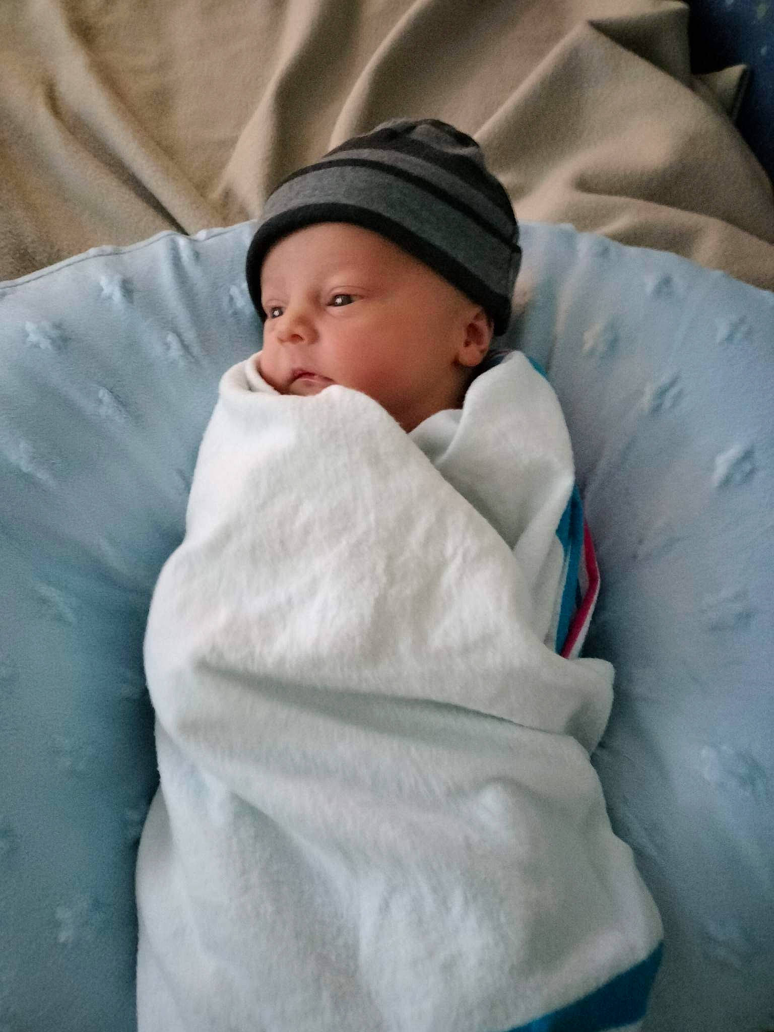 Brenton is registered to the contest to win money with this photo: baby, baby_sleeping, bedtime, child, comfort, event, headwear, linens, nap, person, room, sleep, toddler, winter