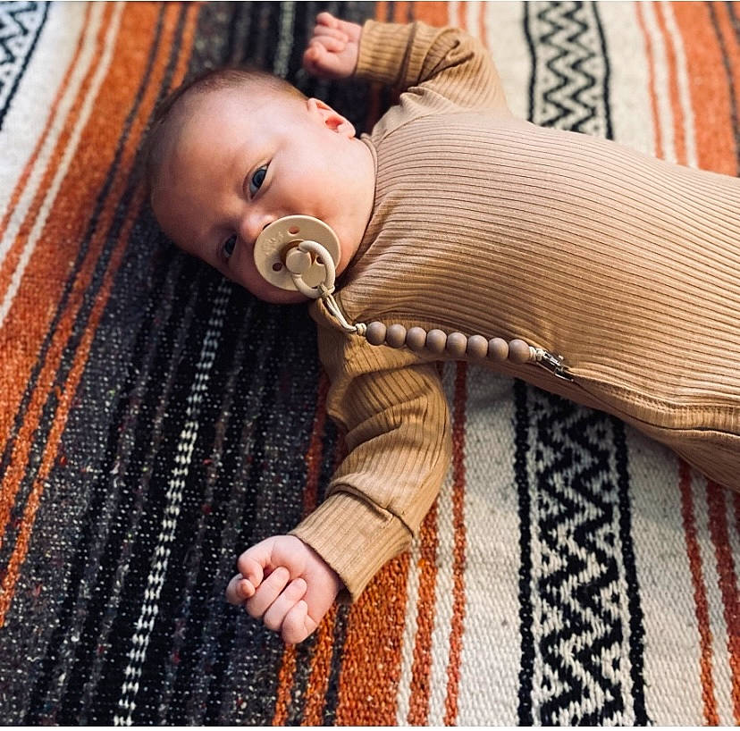 Waylon joined the competition — help win amazing prizes! baby, baby_products, baby_sleeping, baby_toddler_clothing, bedding, cheek, child, comfort, eye, flooring, fur, hardwood, linens, pattern, person, sitting, skin, sleeve, textile, toddler