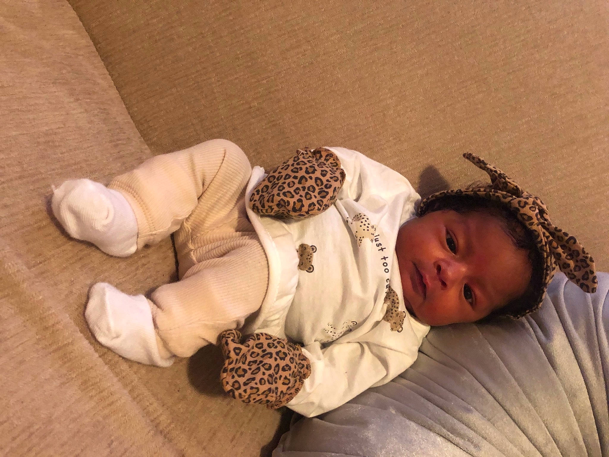 Leilani is registered to the contest to win money with this photo: arm, art, baby, baby_sleeping, baby_toddler_clothing, bed, bedding, child, comfort, fashion_accessory, flooring, foot, headgear, human_body, linens, pattern, person, room, sleeve, toddler