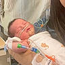 Sylis joined the competition — help win amazing prizes! adult, baby, bedside, blanket, care, closeup, face, healthcare, holding, hospital, hospital_gown, indoor, infant, medical_care, medical_tubes, newborn, patient, person, person_holding_baby, resting