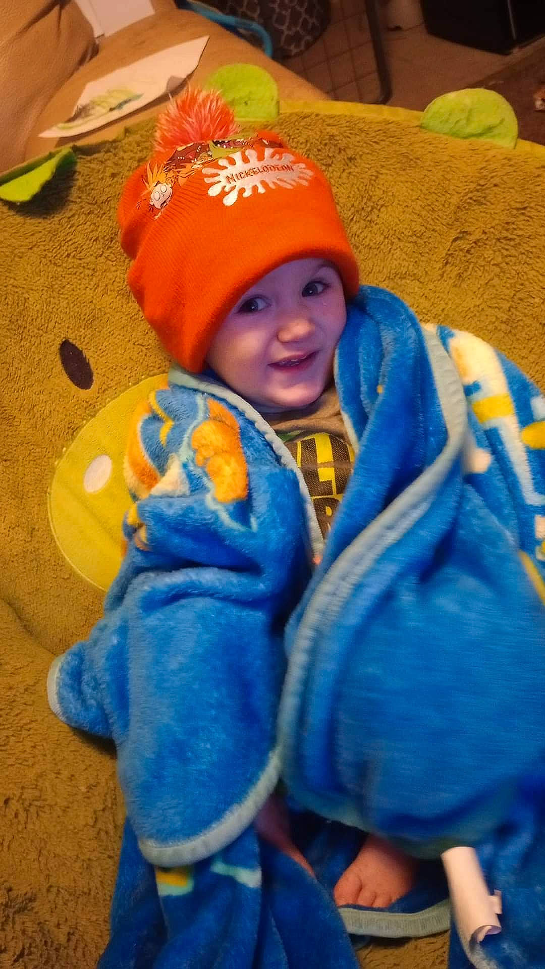 Oliver is registered to the contest to win money with this photo: baby, baby_toddler_clothing, blue, cap, child, electric_blue, eye, face, fun, happy, head, headgear, headwear, joy, knit_cap, orange, person, smile, textile, toddler