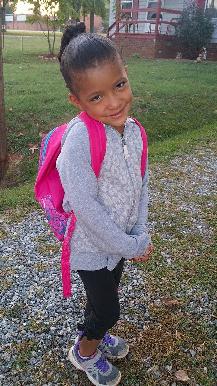 Sienna is registered to the contest to win money with this photo: child, day, fun, girl, grass, joy, outerwear, person, pink, plant, play, purple, recreation, smile, standing, toddler, tree, vacation