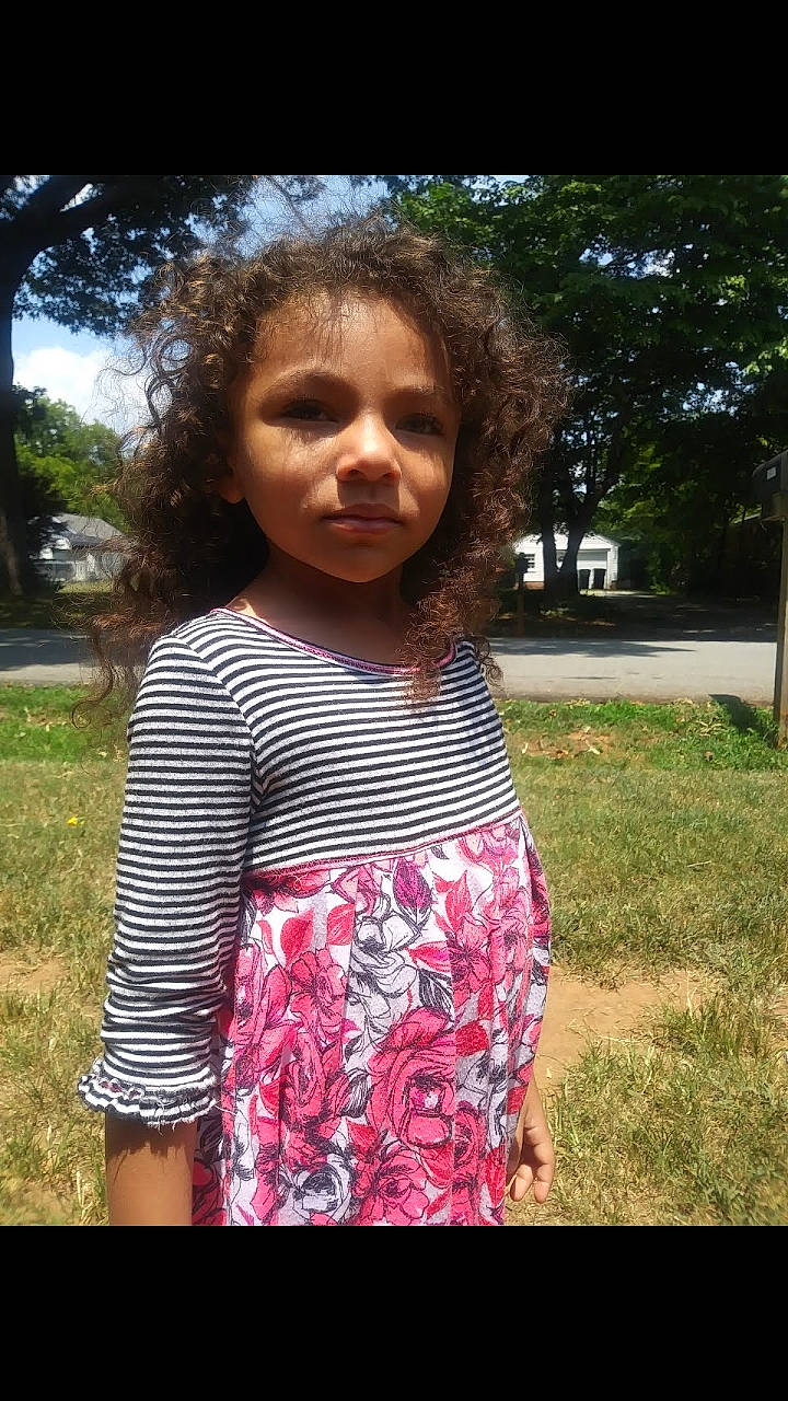 Suraya joined the competition — help win amazing prizes! beauty, black_hair, child, cool, emotion, eye, face, facial_expression, fun, girl, grass, hair, hairstyle, head, human, person, pink, smile, toddler, tree