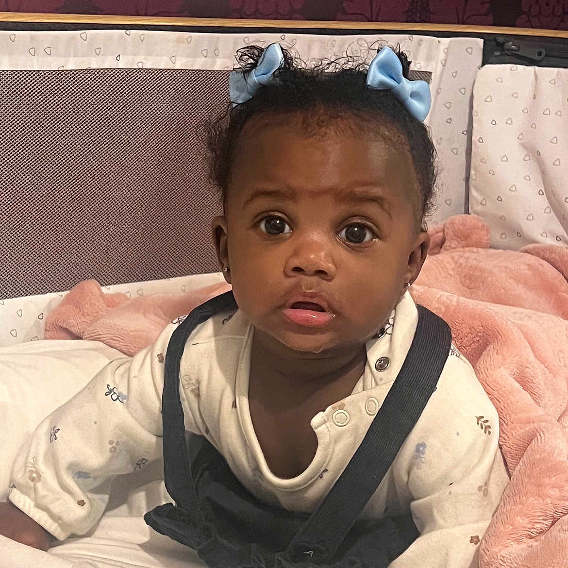 Amandla is registered to the contest to win money with this photo: baby, bed, blackhair, bodypart, couch, crawling, face, finger, frown, furniture, hair, hand, happy, head, person, photography, portrait, sad, sitting, smile