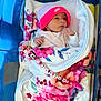 newborn, baby, infant, blanket, floral, pink_hat, nike, pacifier_clip, minnie_mouse, hospital_bassinet, blue_bassinet, cute, wrapped, lying_down, person, child, indoors, soft, cozy, peaceful