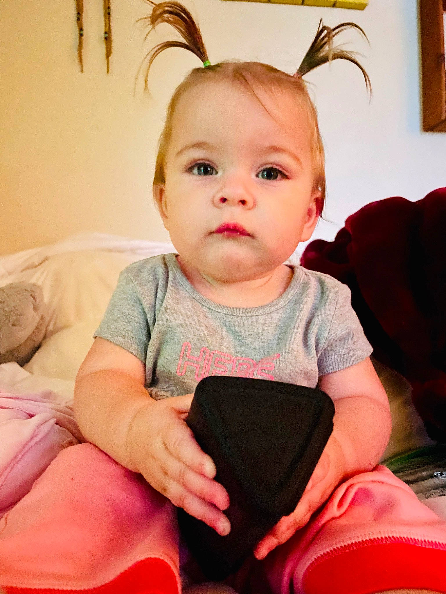 Florence is registered to the contest to win money with this photo: baby, baby_toddler_clothing, cheek, child, chin, comfort, eyelash, facial_expression, fun, hairstyle, happy, lap, person, product, red, sitting, skin, sleeve, standing, t_shirt